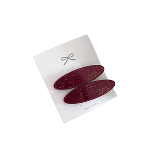 Elegant wine red oval acetate hair clips with silver glitter and gold lettering