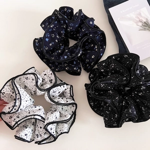 Three vintage floral scrunchies with layered ruffles and black contrast edges