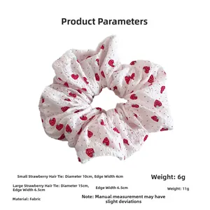 Size comparison of small and large strawberry print scrunchies in 10cm and 15cm diameters