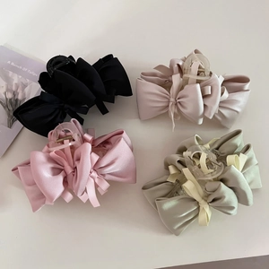 Elegant large satin bow hair claws in black, beige, pink and green for stylish hair styling