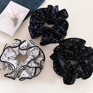 Three-piece set of floral scrunchies with pleated edges and delicate piping detail