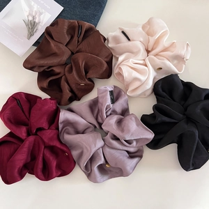 Five-piece satin hair scrunchie set in assorted colors with elegant gold metal tags