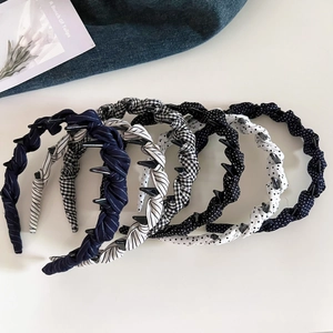 Close-up of non-slip fabric headbands with polka dot and stripe patterns for women