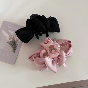 Elegant satin bow hair claw clips in black and pink for French style women's hairstyles