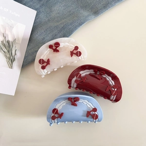 French style cherry hair claw clips in pearl white, red and blue with wavy patterns