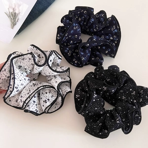 Three-piece set of floral scrunchies with pleated edges and premium chiffon texture