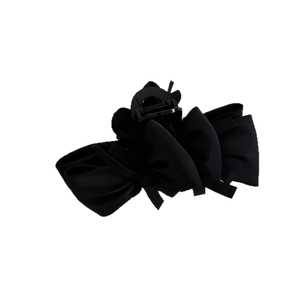Elegant black satin bow hair claw clip for women's half-up hairstyles on white background