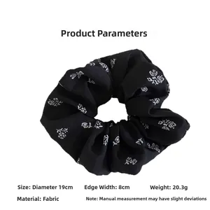 Detailed size view of a large black rose print fabric scrunchie with 19cm diameter