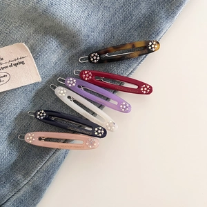 6-piece set of acetate oval hair clips with sparkling rhinestones in assorted colors
