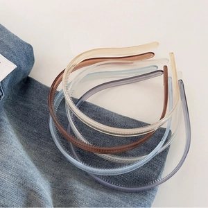 Minimalist jelly color hairbands with anti-slip teeth shown on denim and white surface
