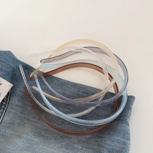 Close-up of semi-transparent jelly colored hairbands with non-slip teeth texture