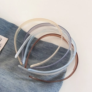 Set of translucent jelly colored non-slip headbands with teeth in various Morandi tones