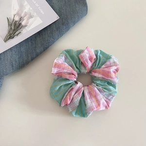 Pink and white checkered scrunchie with mint green stripes for stylish hair styling