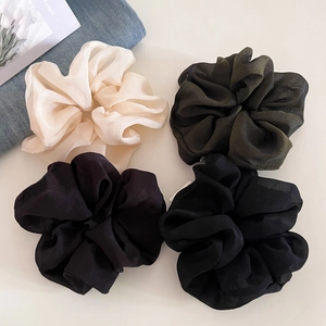 Elegant large organza scrunchies in cream and olive green with a pleated texture finish