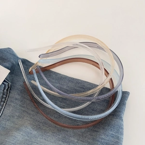Detail showing non-slip inner teeth and translucent resin material of the hairbands