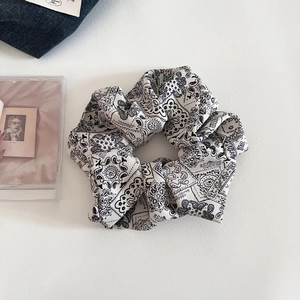 Vintage paisley print large scrunchie in black and white fabric for versatile hairstyles