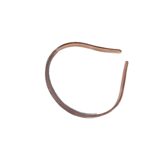 Minimalist amber jelly colored headband with anti-slip inner teeth on white background