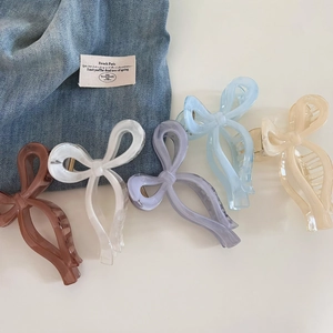 Elegant bow hair claws in five gradient colors including cream blue and purple