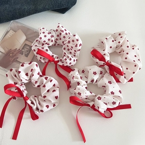 Floral and polka dot scrunchies set with red ribbons and heart patterns