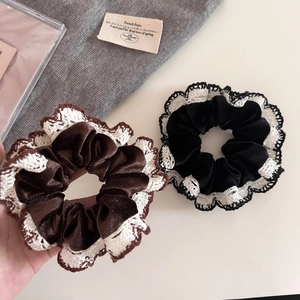 Elegant vintage black and brown velvet scrunchies with white lace edges for hair styling
