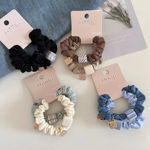 Minimalist elastic hair scrunchies set with square beads and gold metal tag accents