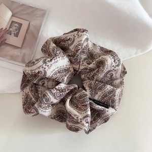Elegant vintage paisley silk scrunchie with French style pattern for hair styling