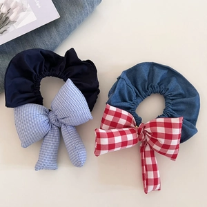 Detail view of plaid ribbon hair ties set made of denim and padded cotton material