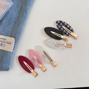 Detailed set of 6 oval acetate hair clips in assorted colors with gold metal alligator grips
