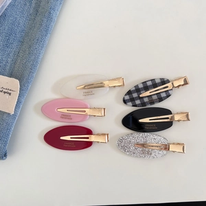 Set of six colorful acetate oval hair clips with golden metal base for daily styling