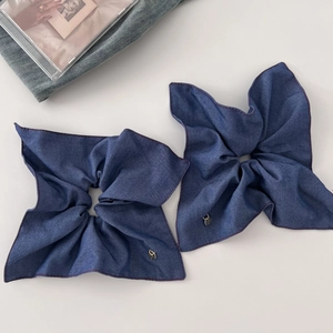 Vintage denim blue scrunchie with red stitching and gold pendant for low ponytail