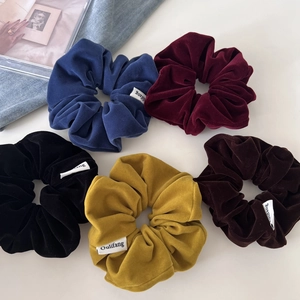 Five-piece vintage velvet scrunchies set in assorted colors on a clean white background
