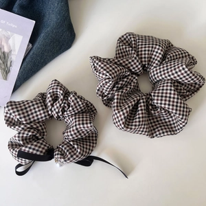Classic plaid fabric hair scrunchies set with a stylish ribbon bow and pearl bead detail