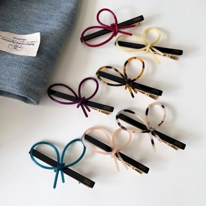 Detailed collection of handmade acetate bow hair clips in various elegant colors and patterns