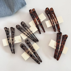 Set di fermagli per capelli vintage maculati nei toni marrone scuro e grigio freddo