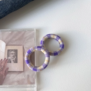 Elastic seamless checkered hair ties in purple and beige plaid knit for ponytails