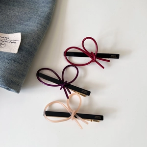Three-piece set of elegant acetate bow hair clips in wine red, purple, and soft pink colors