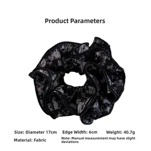 Detail view of ink tie-dye fabric scrunchie with 17cm diameter and 6cm width dimensions