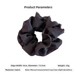 Detail of dark grey heart scrunchie with red stitching, diameter 13.5cm and width 4cm