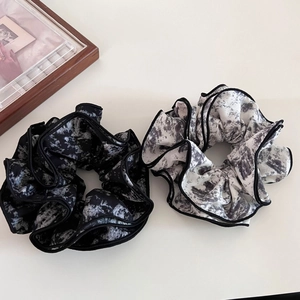 Elegant ink-wash tie-dye scrunchies in black and white chiffon for bun hairstyles
