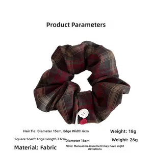 Detail of vintage red checkered scrunchie with button accents and size dimensions