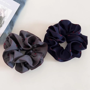 Elegant grey heart pattern hair scrunchies with red contrast stitching for stylish buns
