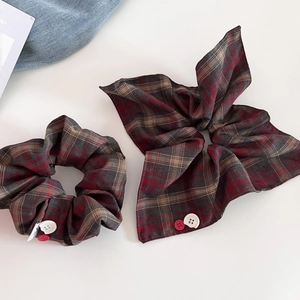 Retro red and blue plaid scrunchie set with decorative buttons and bow detailing