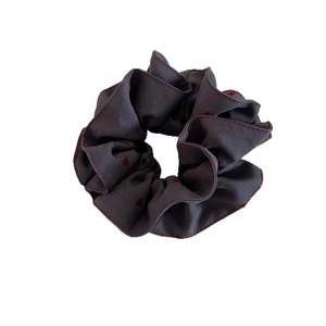 Dark grey heart print scrunchie with red lettuce edge trim for women's hair styling