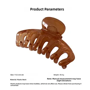 Detail view showing amber jelly hair claw clip with 11.5cm length and resin material