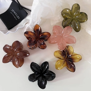 Set of 6 vintage resin flower hair claws in amber, pink, green, and black glossy finishes