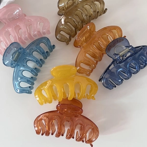 Group of large translucent jelly colored hair claws with durable metal springs in a variety of hues