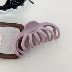 French style lavender hair claw clip for thick hair shown on a white tabletop background