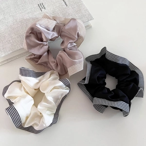 Three-piece checkered satin scrunchie set in gold, white and black colors