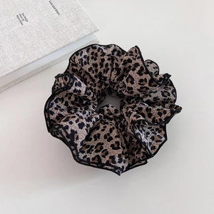 Retro leopard print oversized hair scrunchie with black trim on white background