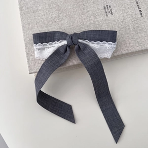Elegant grey fabric bow hair clip with white lace trim and long ribbons for women